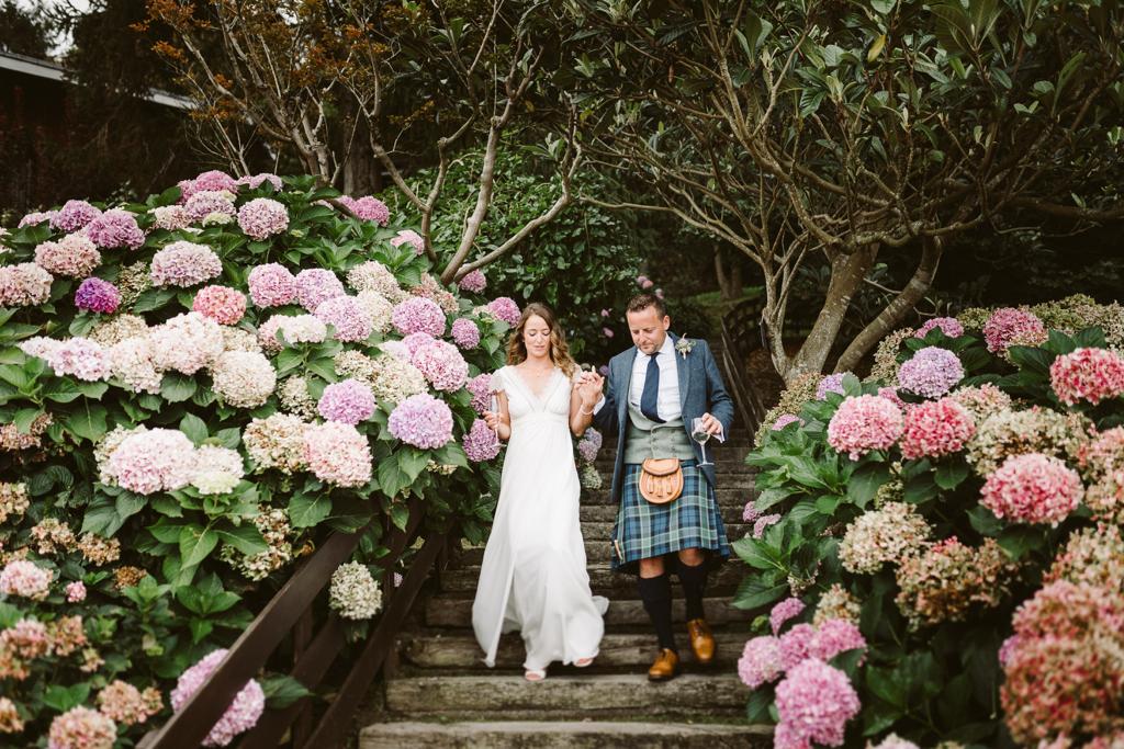 Couple walking down steps on wedding day